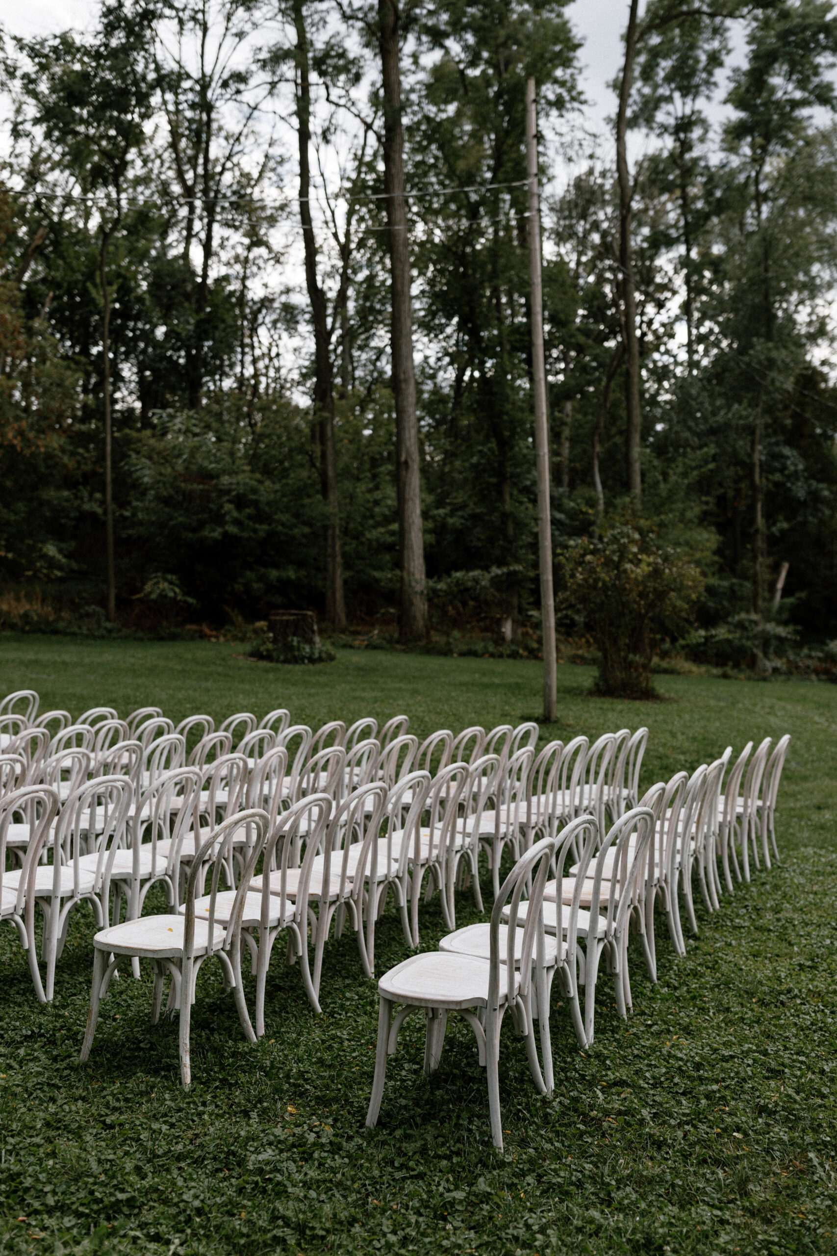 White bentwood chairs ceremony setup at an outdoor wedding in Lake Geneva Wisconsin