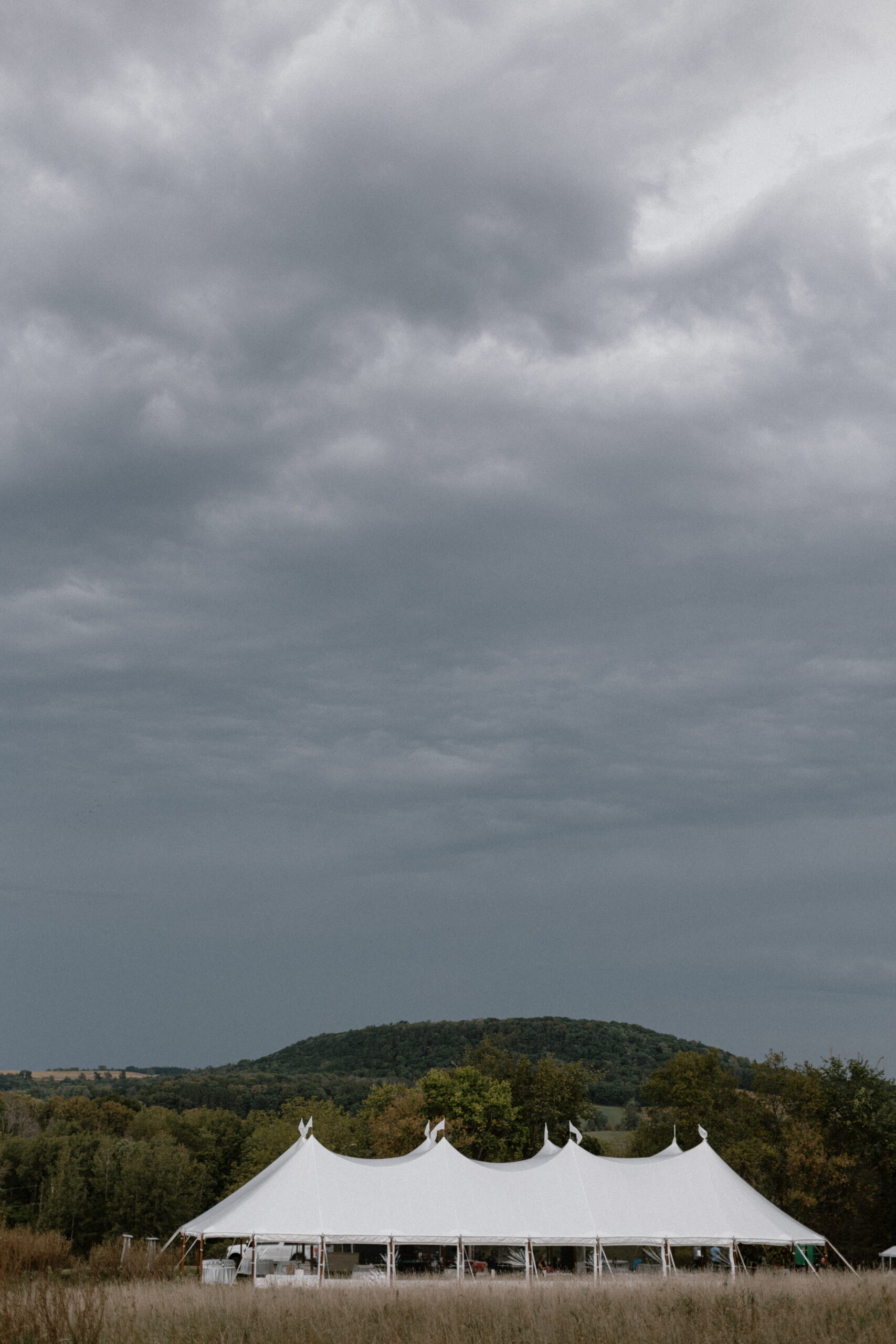 Outdoor wedding reception in Baraboo, Wisconsin with an Event Essentials sailcloth tent