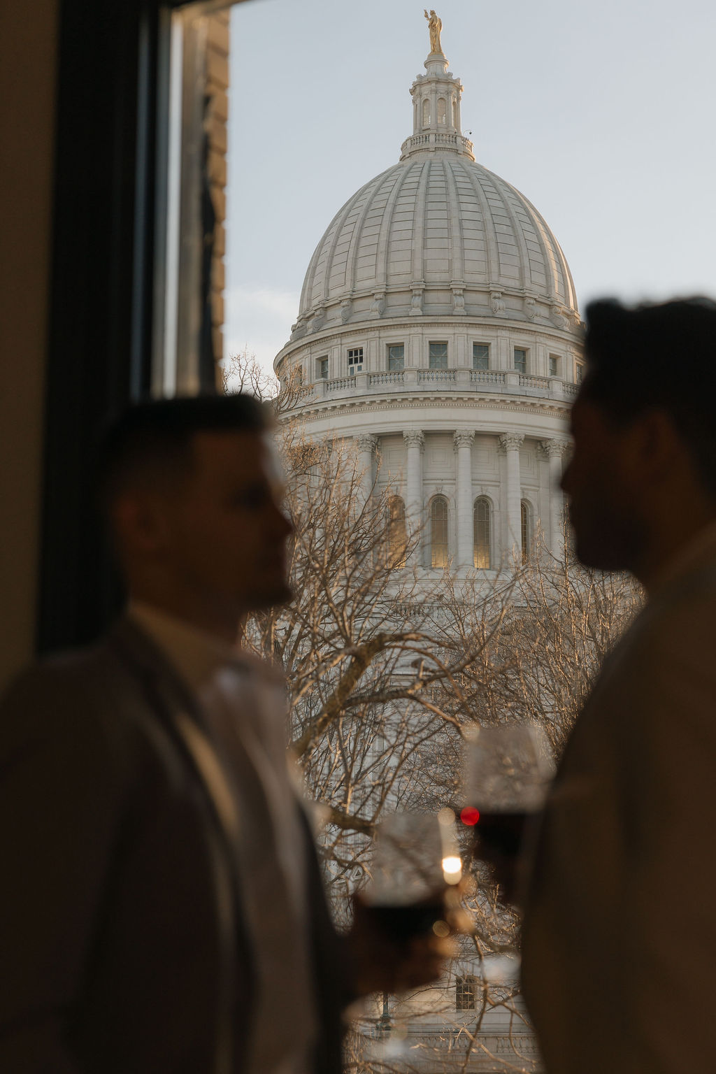 Couple portraits with Wisconsin State Capitol Building in Madison, WI
