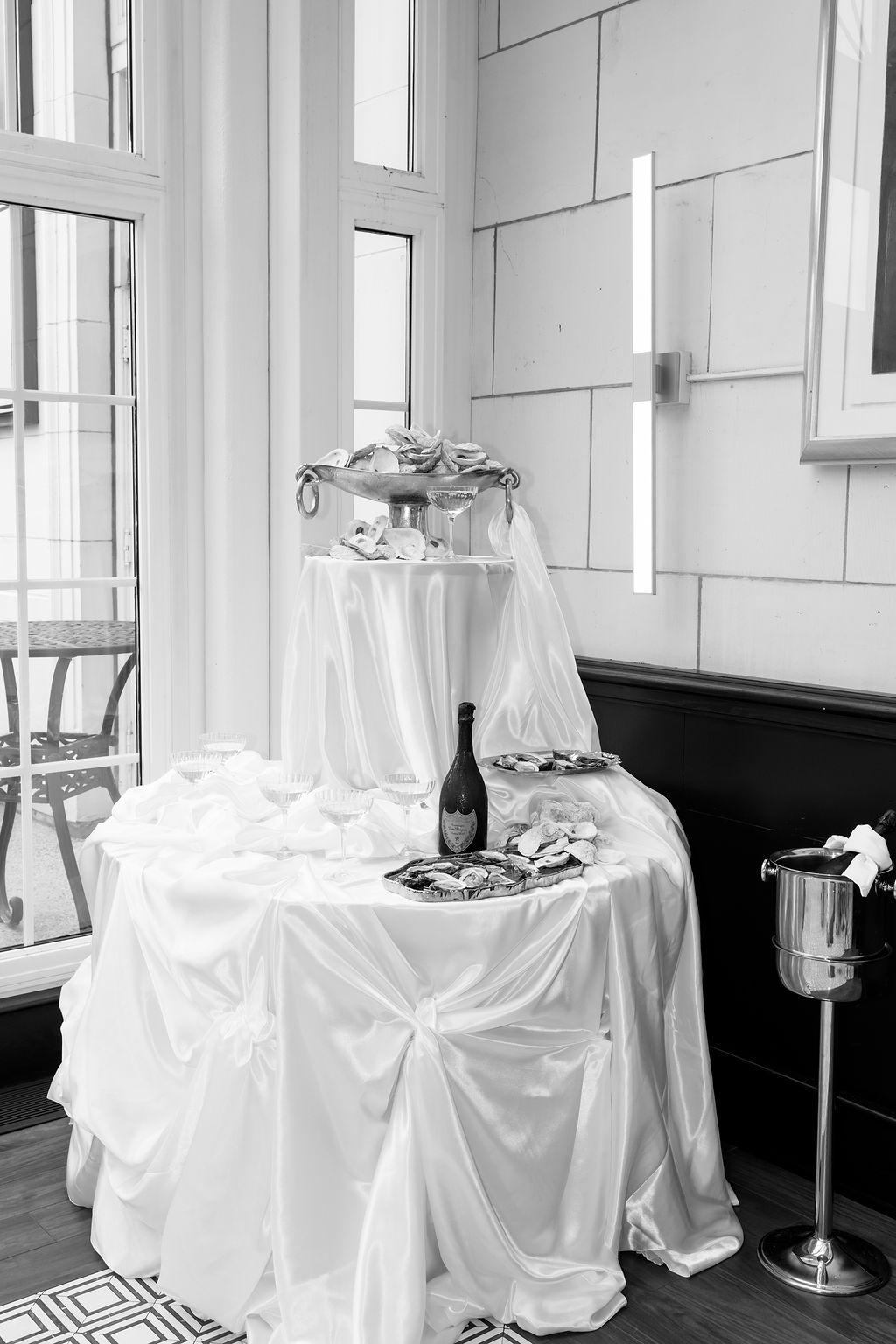 Champagne and oysters table at a wedding at Bacchus MKE