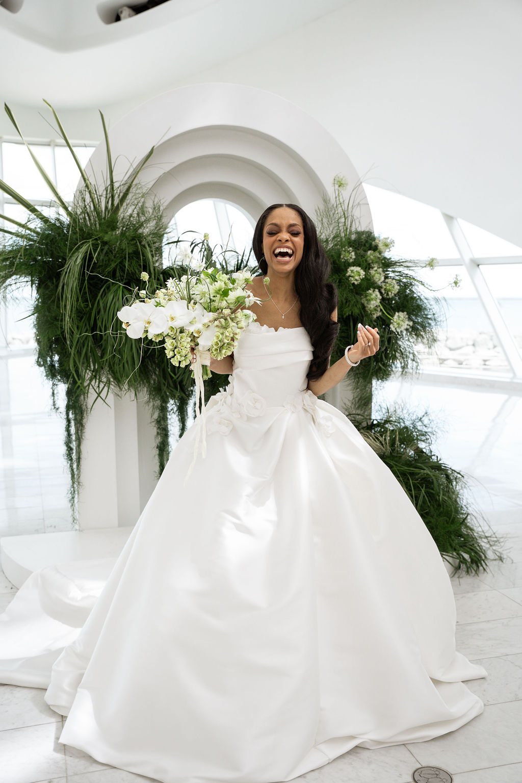 Bridal portrait in front of ceremony backdrop at the Milwaukee Art Museum