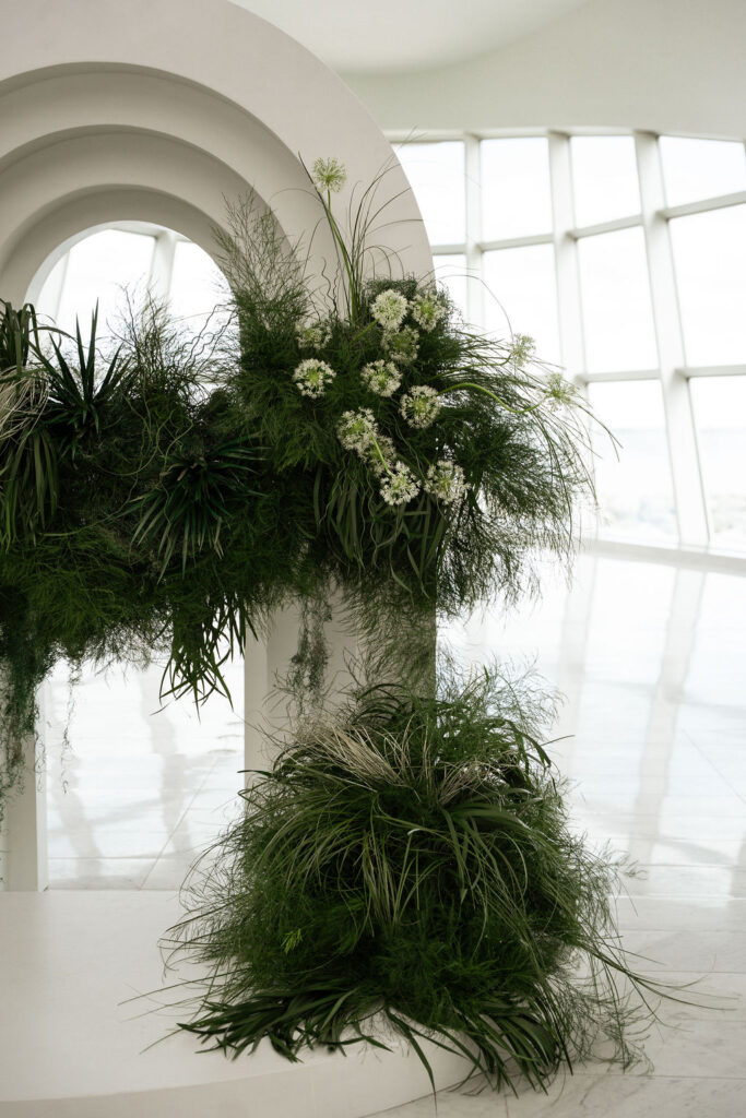 ceremony arch with grasses at art museum