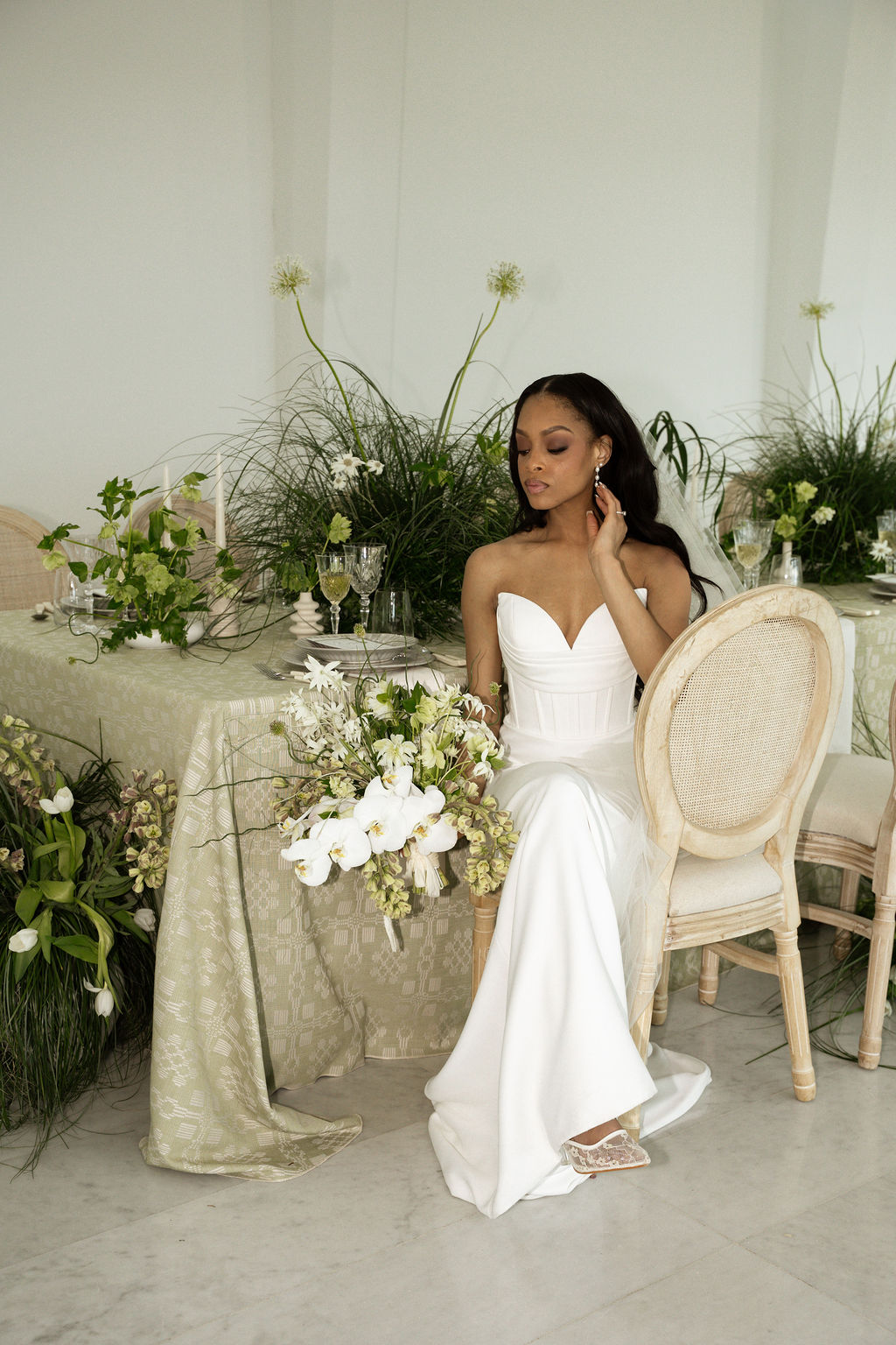 Bride sitting at wedding reception table at MKE Art Musuem