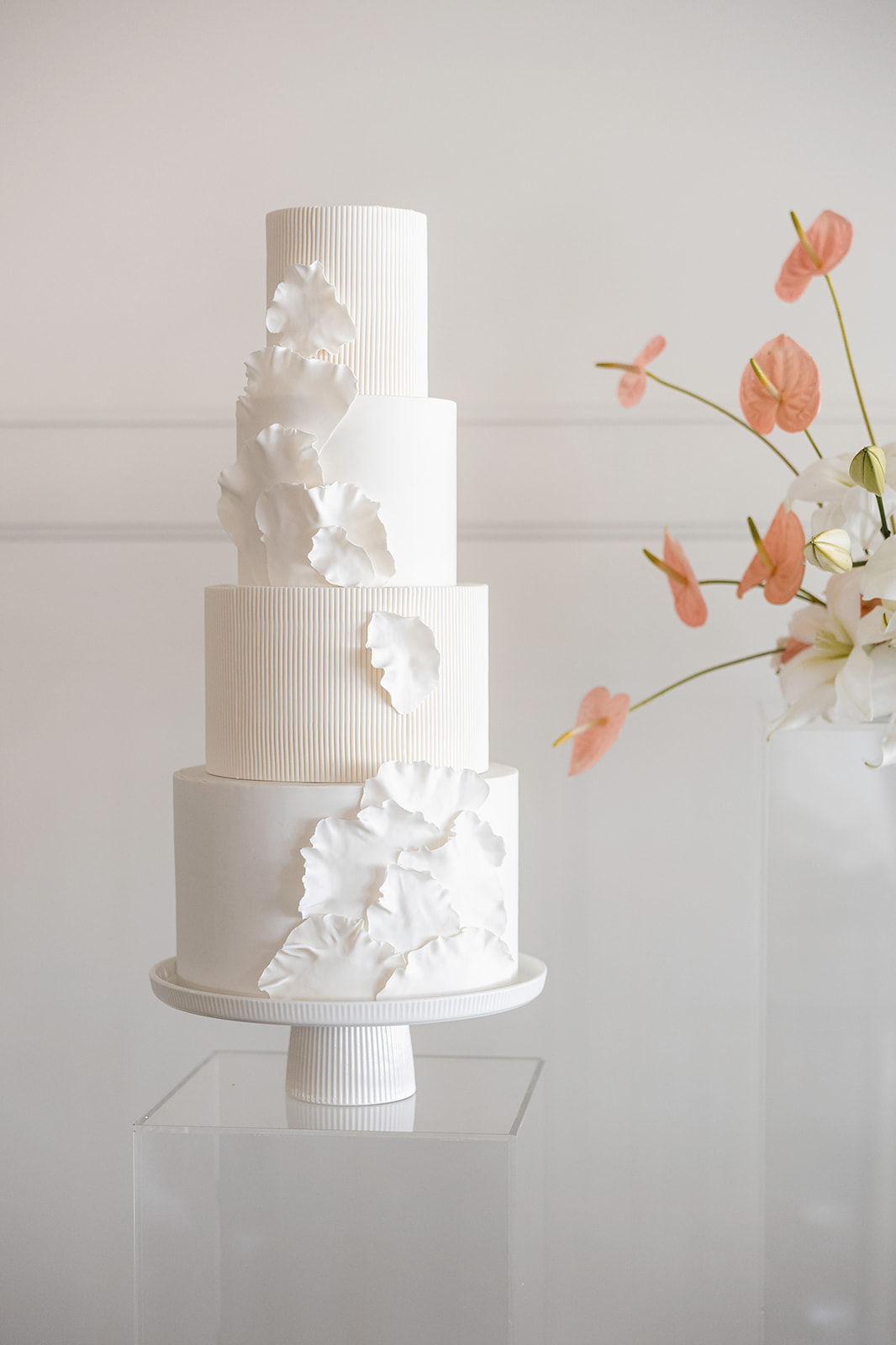 Four-tier wedding cake by Whisk Chick in Milwaukee, WI